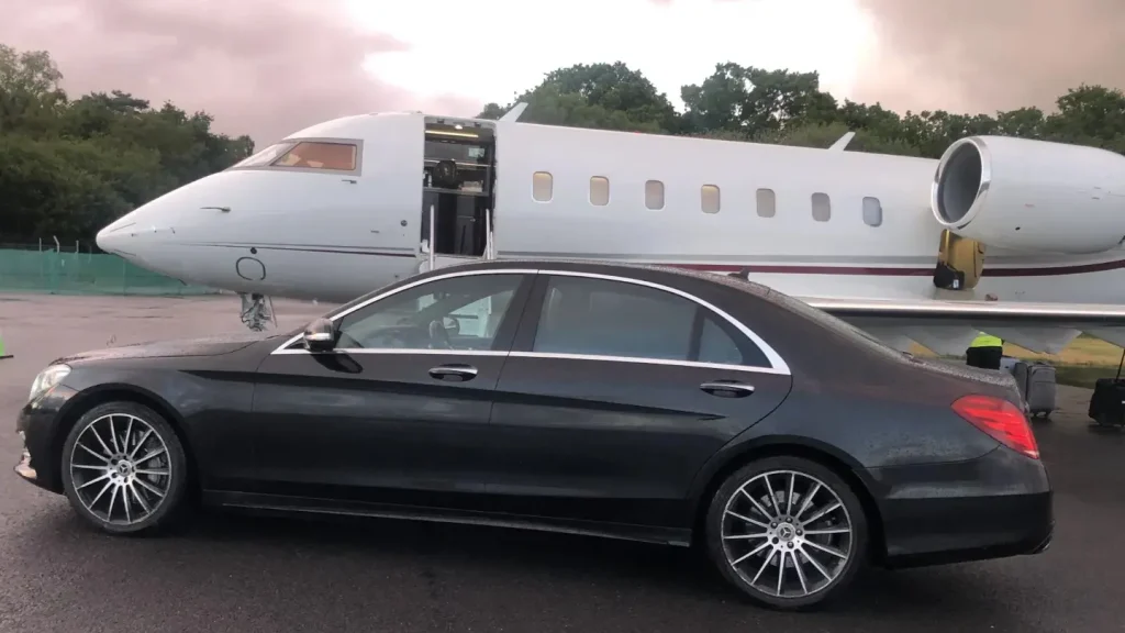 Code E Cars Chauffeur Service Bournemouth Christchurch Poole S-Class Mercedes parked by Private Jet