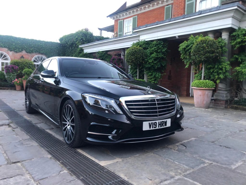 Mercedes S Class (LWB) parked in courtyard of a large house